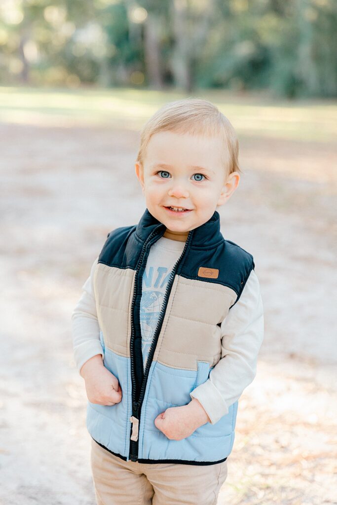 Toddler boy smiles under the oaks in Sea Pines, Hilton Head Island, SC, with Lamp and Light Photography